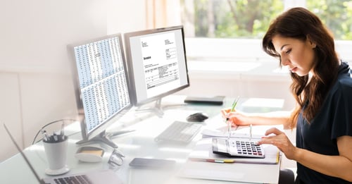 Woman using accounting software on her computer