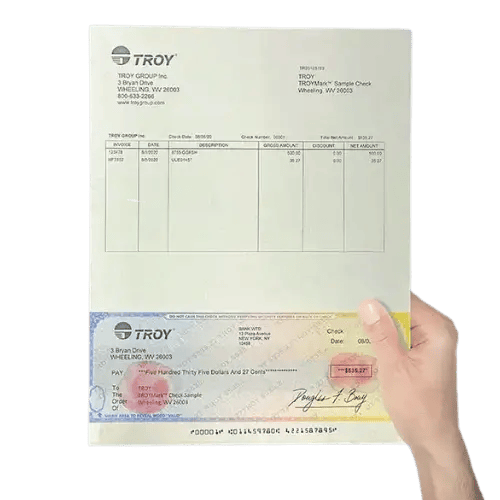 Hand holding up check showing MICR Toner Secure