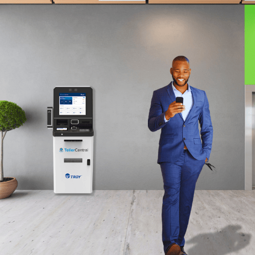 Man with blue suit on walking away from self-service machine copy