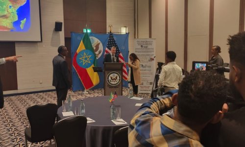 Mark  Bond giving presentation in Ethiopia in front of news cameras