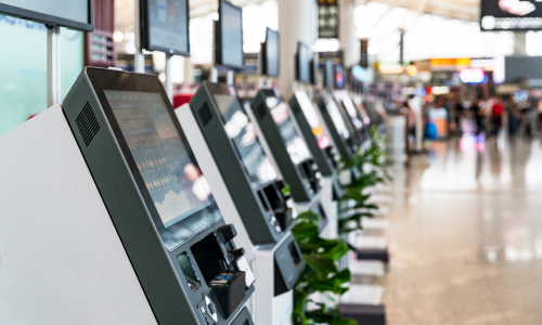Card printing machines lined up at an airport 