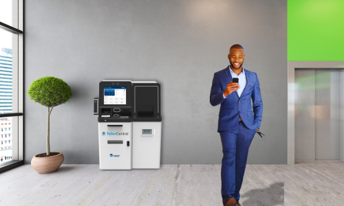 Man in blue suit walking away from TellerCentral machine 