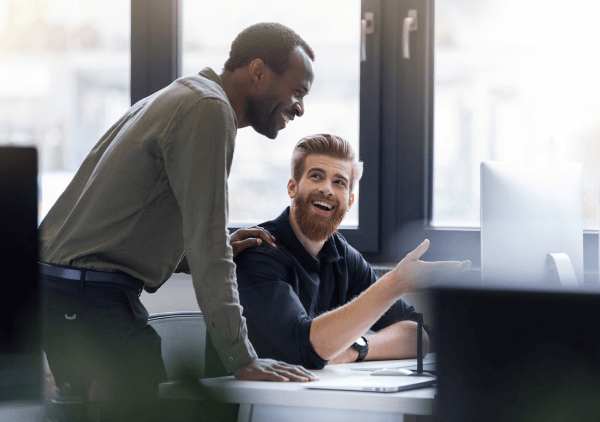 Men working at an office having an exciting conversation