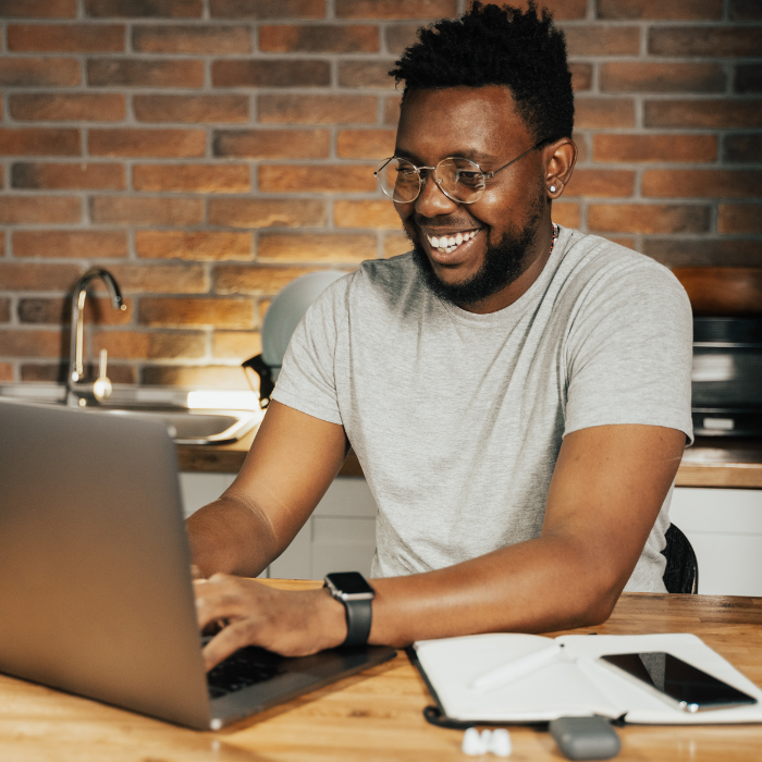 Man using mailing software at desk  copy